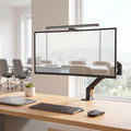 Monitor arm, light bar and wireless mouse bundle on desk