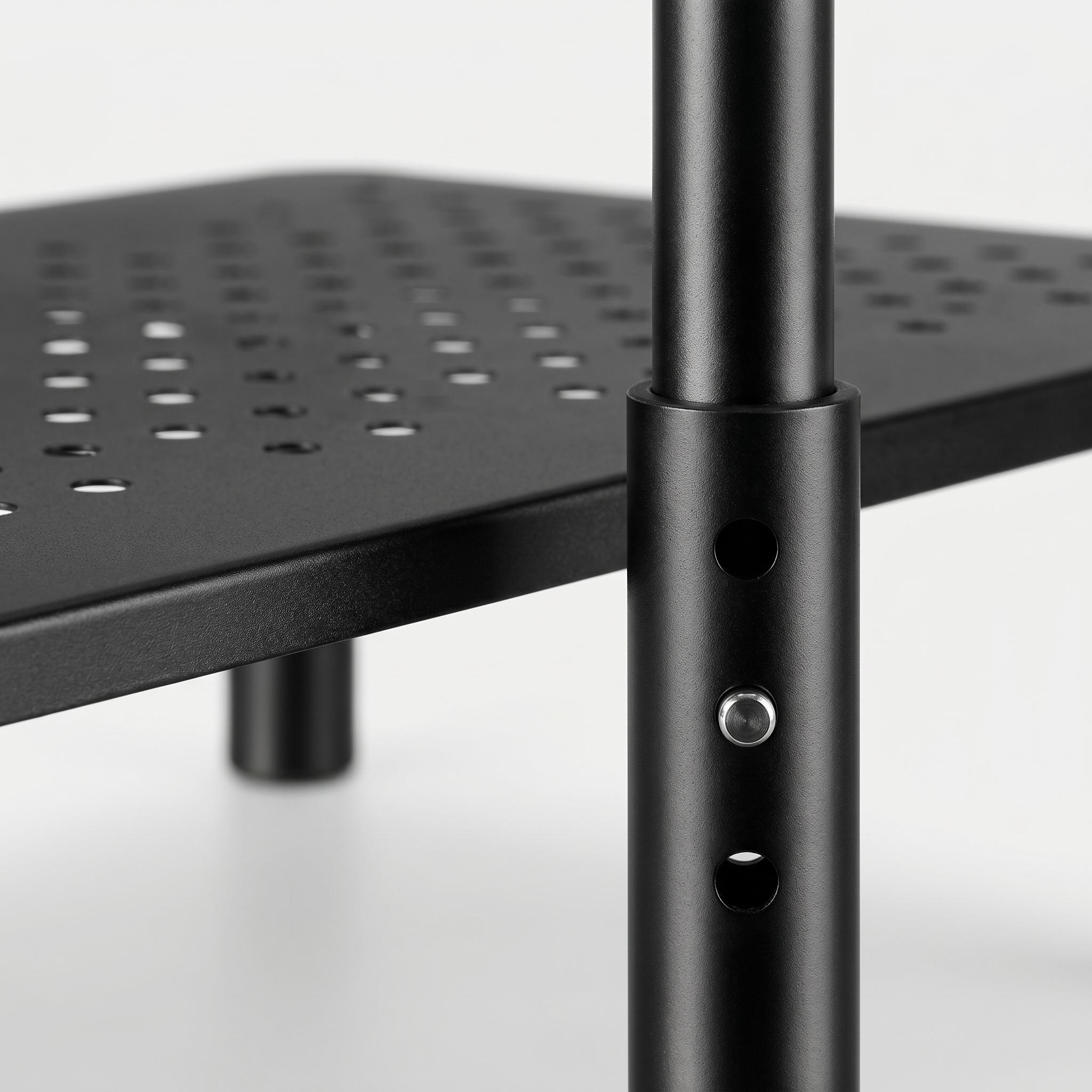 Close-up of laptop riser height adjustment mechanism showing three height settings